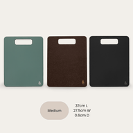 Custom Chopping Board in Medium, shown in all three colourways: Eucalyptus Green, Nutmeg Brown, and Liquorice Black. 37cm L × 27.5cm W × 0.6cm D.