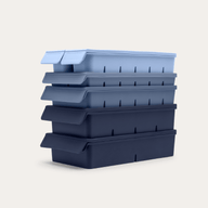 Complete Freezer Tray Set stacked in Blueberry Blue, side-angle view showing the gradient from light blue-grey to deep navy across the 5 kinds of trays