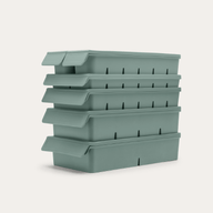 Complete Freezer Tray Set stacked in Eucalyptus Green, side-angle view against a neutral background showing the full set of 6 trays with lids