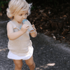 child eating from reusable yoghurt pouch