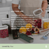 Five-star customer review from Enza T. reading: "I have bought the Tallow glass pantry jars in the past in various sizes and I love them. I am now having to buy them for my mum because she loves being able to see what's in the jars, how they stack so neatly, as well as the different sizes." Shown over a lifestyle image of Tallow Rectangle containers filled with fresh fruit on a kitchen counter.